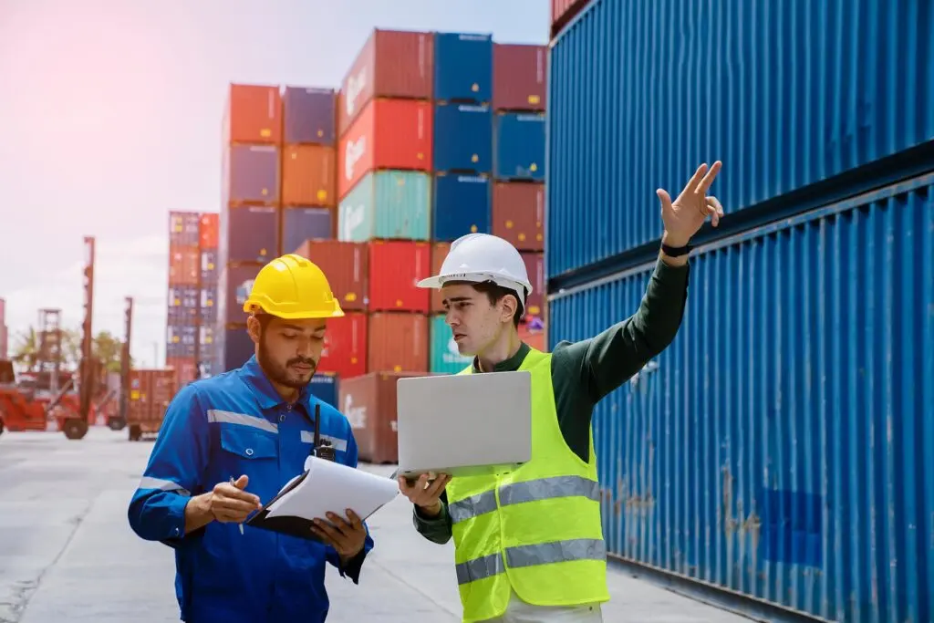 Logistics professionals coordinating container freight